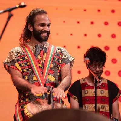 Here's a shot of me and Aditya from the Taal Inc. Rhythm Ensemble during our performance at Mumbai Drum Day 2024. We love sharing the energy of West African music on stage.
