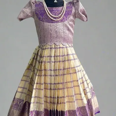 A beautiful example of our kids' wear collection. This traditional lehenga is custom-stitched from one of our popular semi-Kanchi sarees, creating a timeless look for your little one.