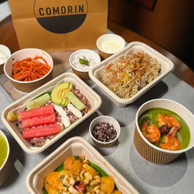 This is what a perfect night in looks like. A full spread of Comorin favorites, from hearty bowls to fresh salads and flavorful sides, all packed and ready to be plated your way.