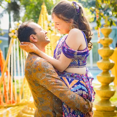 The vibrant colors of their outfits pop against the festive Haldi decor. We love capturing the energy and happiness of pre-wedding functions.