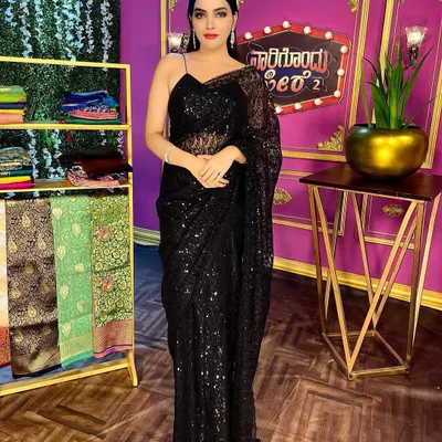For a chic and modern look, this black sequin saree is a showstopper. It's perfect for cocktail parties, receptions, or any evening event where you want to sparkle and make a statement.