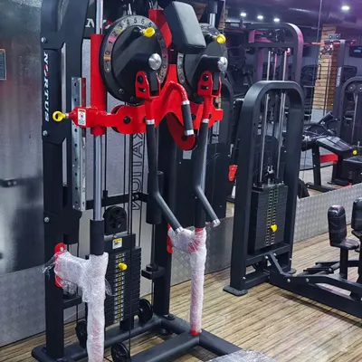 A close up of our new Multi Flight Machine, showcasing its adjustable arms and weight stack for a customized workout.