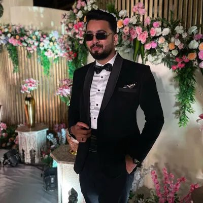 For a classic cocktail night or a formal corporate gala, I always come dressed to impress. A sharp black tuxedo look is perfect for setting a sophisticated and stylish tone before I hit the dance floor.