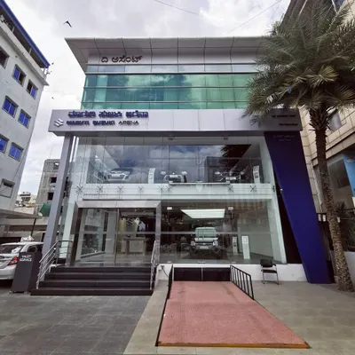 The impressive multi-level facade of the Maruti Suzuki Arena showroom in Bangalore. Our design ensures a strong brand presence with clean lines, extensive glazing, and prominent signage, reflecting a modern and professional retail identity.