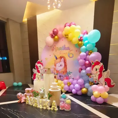 A truly magical unicorn-themed 6th birthday for Annika. We used a pastel balloon garland, custom unicorn cutouts, and elegant pedestal stands to create a whimsical and photo-ready party setup.