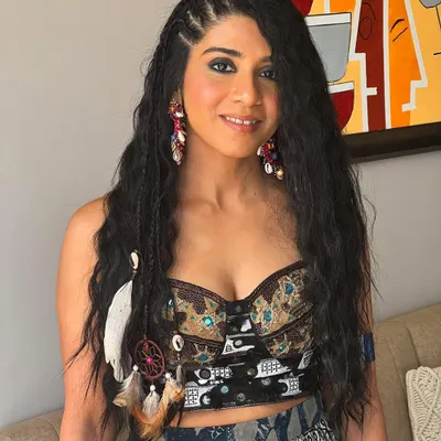 Invest in your hair, it's the crown you never take off. This bohemian-inspired look features multiple small braids and accessories for a fun, festival vibe.