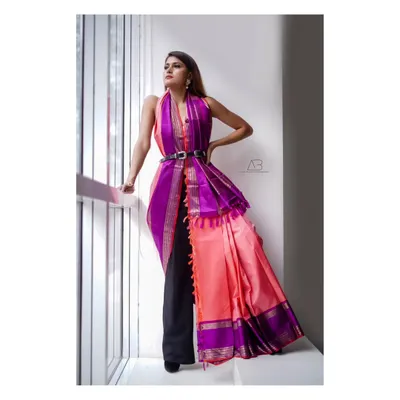 A modern, high-fashion take on the Kanchipuram saree. By styling it over pants with a belt, we created a powerful and unique editorial look that redefines traditional wear.