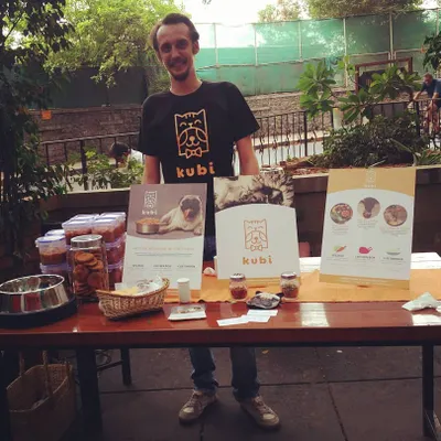 This was a proud day for us at our very first pet event. Our Production Manager is setting up the table with fresh treats and information about our homemade, preservative-free dog food.