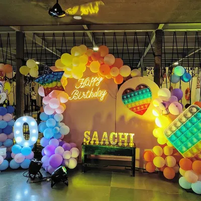 A vibrant Pop-It themed birthday party for Saachi's 10th birthday. Our team loves bringing creative and colorful party ideas to life with custom backdrops, marquee lights, and balloon arrangements.