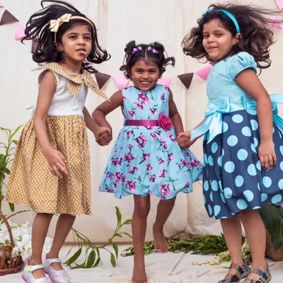 A trio of friends, a trio of styles. I designed these coordinating dresses in polka dots and florals to create a beautiful, harmonious look for their group photos.