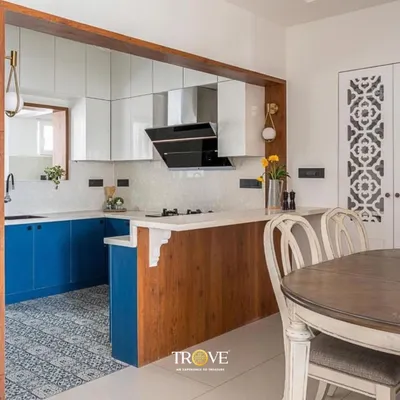 This kitchen showcases a beautiful blend of styles. The patterned floor tiles add a classic touch, while the simple white backsplash provides a clean, modern look that is easy to maintain.