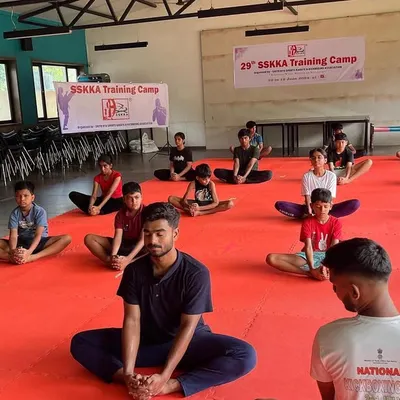 Meditation is a key part of our holistic training approach. Here, students at our 29th SSKKA Training Camp engage in a guided meditation session to calm their minds and improve focus before a day of intense martial arts practice.