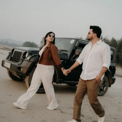 Walking hand-in-hand, leading each other on an adventure. With their Thar in the background, this shot captures the essence of a couple ready to take on the world together.