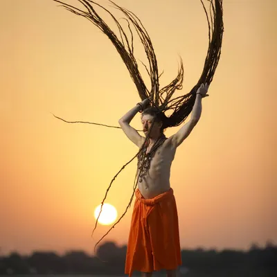 A Sadhu at sunset, with his long dreadlocks thrown into the air. This powerful portrait captures a moment of spiritual expression and freedom, showcasing my ability to document unique cultural practices with an artistic eye.