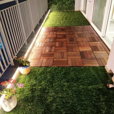 I turned this standard city balcony into a peaceful retreat. The design combines low-maintenance artificial grass with a central walkway of interlocking wooden deck tiles, all highlighted by subtle LED strip lighting for evening ambiance.