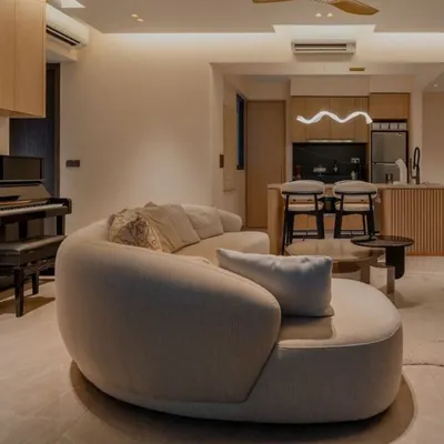 The Poet Sofa, with its elegant kidney-shaped design and clean organic lines, is a masterpiece of modern comfort. Here, it creates a sophisticated and intimate seating area, showcasing its versatility and ability to transform a living space into a stylish sanctuary.
