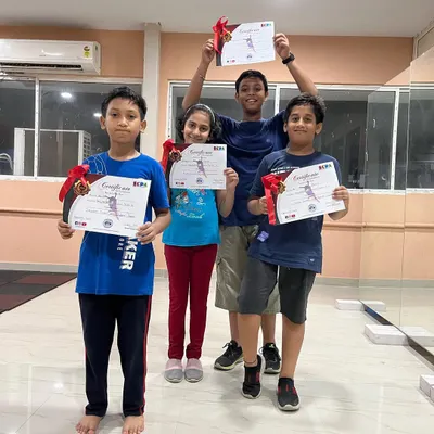 A group of my young students proudly holding their certificates after completing a dance course. It is rewarding to see them achieve their goals.