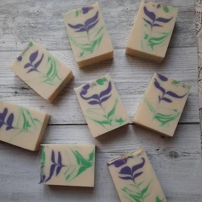 An arrangement of my Blooming Lavender soap bars, each with a unique, hand-poured floral swirl. The design ensures no two bars are exactly alike, just like flowers in a field.