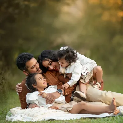 A candid moment of pure family love. I guide my families into comfortable poses and then wait for these unscripted interactions to happen. This is the heart of family milestone photography.