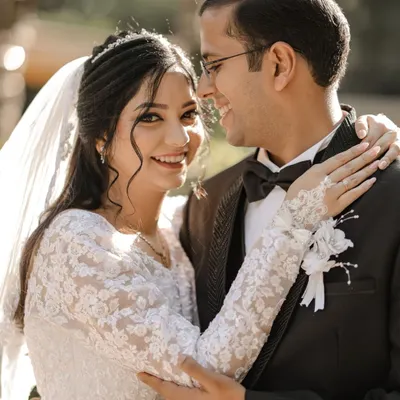 A joyful and candid portrait of the bride and groom after their church ceremony in Delhi.
