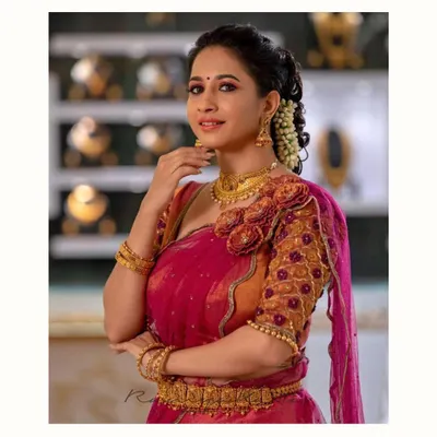 Actress Manvita Kamath looking radiant in our exquisite 3D embellished half saree set. The floral appliqué on the blouse adds a stunning, sculptural element to this traditional ensemble.