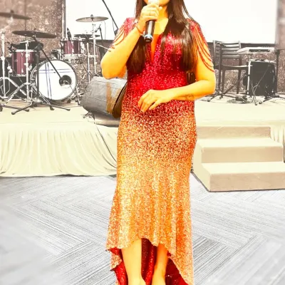 In my element under the spotlight. This look was for a musical night where I wore a sparkling red and gold gown, ready to host an evening filled with melodies and memories.