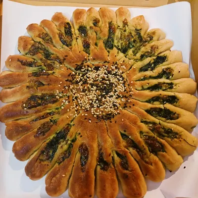 This is my gluten-free Millet Sunflower Bread, stuffed with spinach and a creamy vegan cheese. It's a visual showstopper and a testament to how millets can be used to create delicious, healthy, and innovative baked goods for any cafe or restaurant menu.