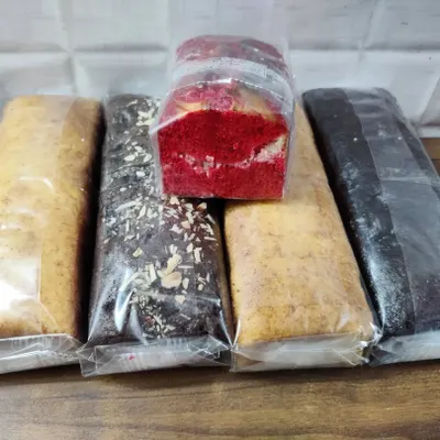 Here you can see the range of my loaf cakes. This picture shows my plain vanilla, chocolate chip, red velvet, and dark chocolate cakes, all wrapped and ready to go.