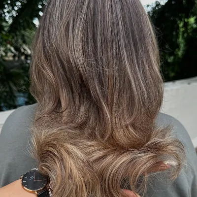 Another look at my 'Vanilla Butter Cream' creation. This is a fantastic way to blend grey hair into a stylish, modern blonde look. The ash tones help neutralize any brassiness for a cool, creamy finish.