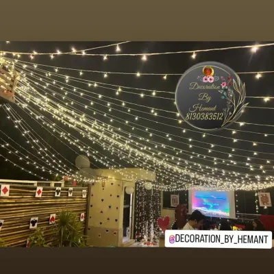 A canopy of fairy lights creating a magical ceiling for a terrace party. This lighting setup completely transforms an outdoor space, making it perfect for an evening celebration.