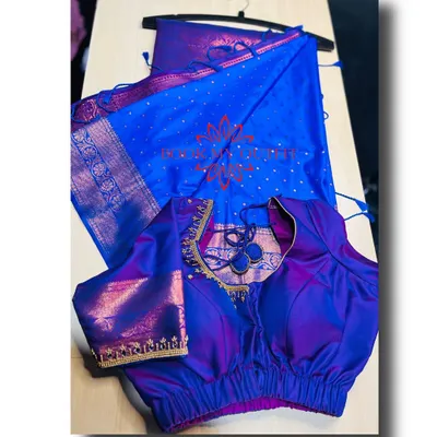 Here is the full look of the iridescent blue and purple silk saree paired with its custom-designed blouse. The unique back cutout and puff sleeves complement the traditional saree perfectly.