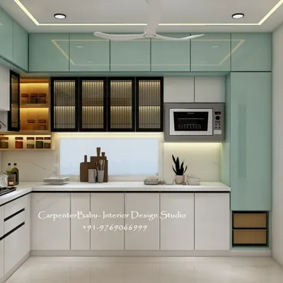 A sleek L-shaped kitchen with a two-tone color scheme. The mint green overhead cabinets add a fresh pop of color, while the backlit open shelves provide stylish and accessible storage for spices.