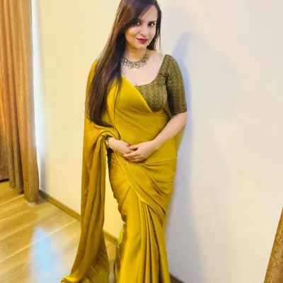 A full view of a custom saree I designed for Diwali. The rich mustard yellow fabric has a beautiful drape, and I paired it with a custom-fit blouse in a contrasting chevron print.