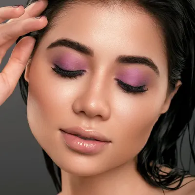 A throwback to a favorite collaboration, this shot features a beautiful lilac eyeshadow look. The wet-look hair and glossy lips create a modern, editorial feel, showcasing a perfect synergy between makeup, hair, and photography.