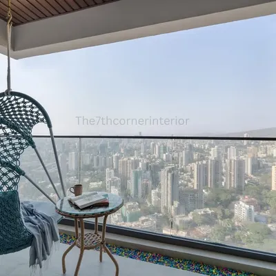 This 2BHK apartment in Borivali boasts a stunning 360-degree vista of the Mumbai skyline. I designed the balcony with a comfortable swing chair to create a perfect spot for enjoying the mesmerizing sunset.