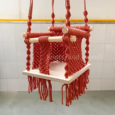 Here's another look at my macrame baby swing, showing the secure construction and detailed knotwork on the sides. It’s designed to be sturdy and safe, so your child can swing happily.