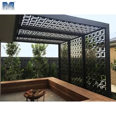 A modern outdoor seating area defined by a custom-designed metal pergola. The laser-cut geometric patterns on the roof and side panels create a unique visual effect while providing shade and privacy.