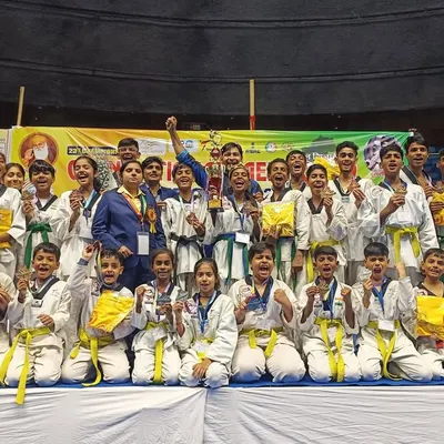 The joy of victory. Our team celebrates winning the Runner Up Team Trophy with 17 Gold, 9 Silver, and 4 Bronze medals at the Open National Taekwondo Championship.