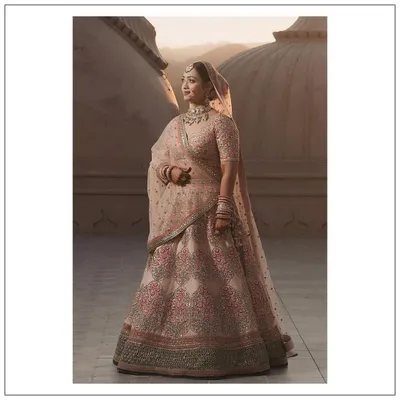 A full view of Somya's stunning Sabyasachi wedding lehenga in Jaipur. We focused on finding a piece that felt both grand for the occasion and personal to her taste, resulting in this beautiful pastel creation.