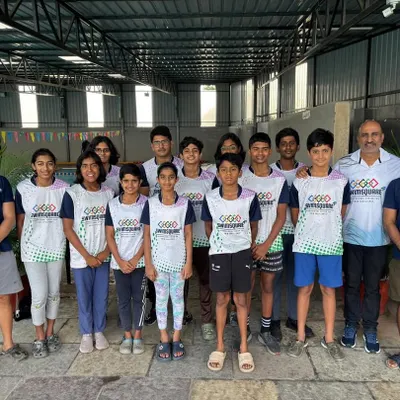 Our dedicated swimmers and coaches, ready to make waves at the NRJ State Swimming Championships. This is Team Swimsquare.
