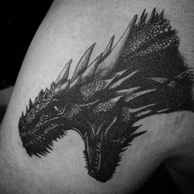 This detailed black and grey portrait of the dragon Balerion is a prime example of my work with mythical creatures. I use dotwork and shading to create realistic depth and texture.