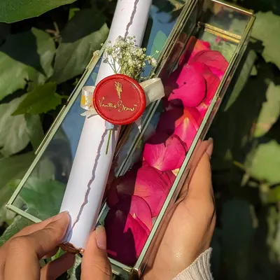 Our Vintage Love Letter Scroll, a timeless romantic gesture. Your personalized message is presented on aged paper with a wax seal in a keepsake glass box.