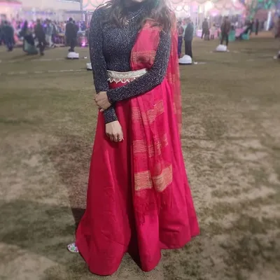 A client styled our bright red skirt with a shimmery black turtleneck for a winter wedding. This shows how you can creatively style our rental pieces to suit your personal taste and the weather.