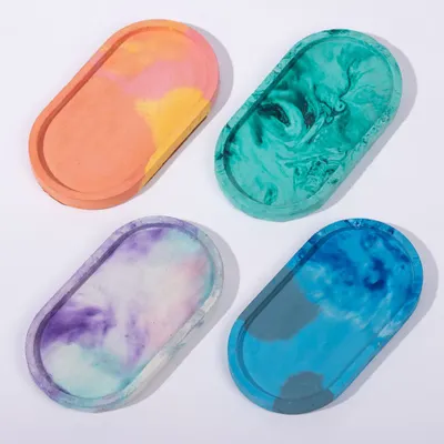 It’s okay to show all your colors. This set of four concrete trinket trays showcases the beautiful marbled and tie-dye effects I can create, making each one a small piece of art.