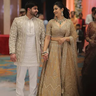 Our official engagement look. We opted for coordinated neutral outfits with heavy embroidery to feel special, with my emerald jewelry adding a perfect touch of color.
