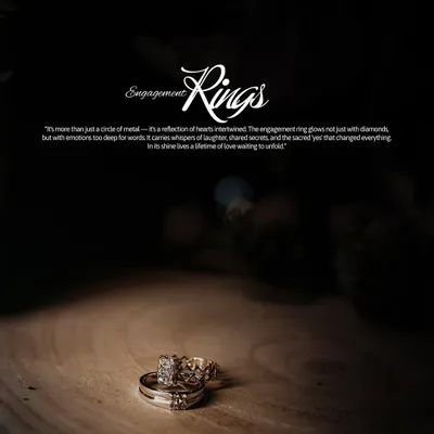 A dramatic, spotlight shot of the engagement rings resting on a piece of wood. This isn't just a photo of jewelry; it's a portrait of a promise.