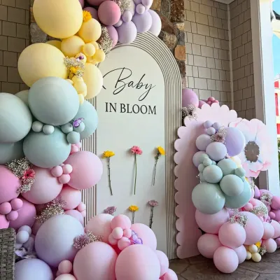 A beautiful 'Baby in Bloom' theme brought to life with a cascade of pastel balloons and fresh flowers. This setup shows our expertise in creating modern, photo-ready backdrops.
