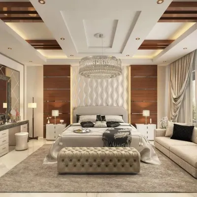 This is a truly luxurious master bedroom suite. I designed it with a stunning crystal chandelier, a custom upholstered headboard with 3D wave panels, and a separate seating area, creating a five-star hotel feel at home.