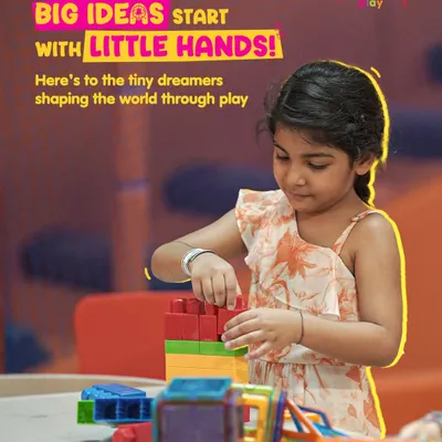Big ideas start with little hands! Here, a young creator is focused on building with magnetic tiles. Our creative stations are where imagination takes shape, fostering innovation and problem-solving skills.