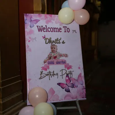 A personalized welcome board for a butterfly-themed first birthday party. This is a beautiful way to greet your guests and introduce the theme.